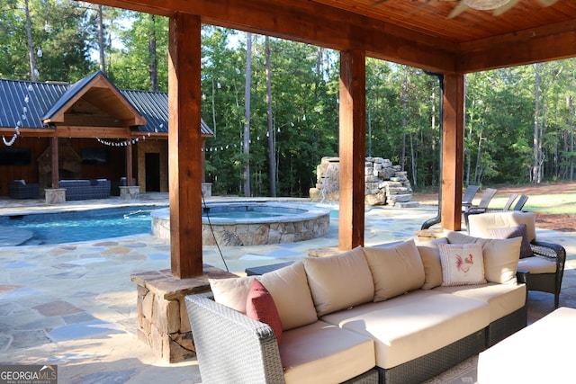 view of patio featuring a swimming pool with hot tub, an outdoor living space, and pool water feature