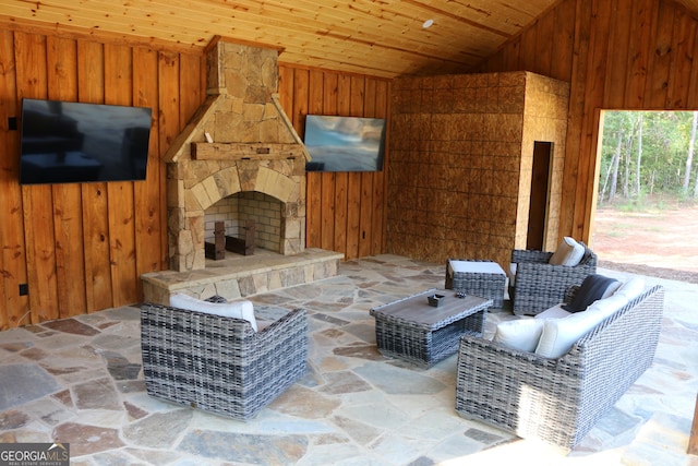 view of patio / terrace with an outdoor stone fireplace