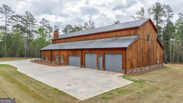 garage featuring a lawn