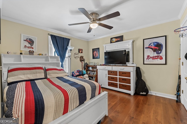 bedroom with ceiling fan, dark hardwood / wood-style flooring, and ornamental molding