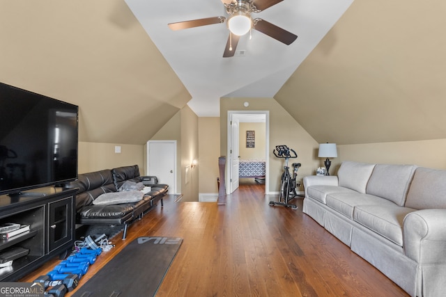 living room featuring hardwood / wood-style flooring, lofted ceiling, and ceiling fan