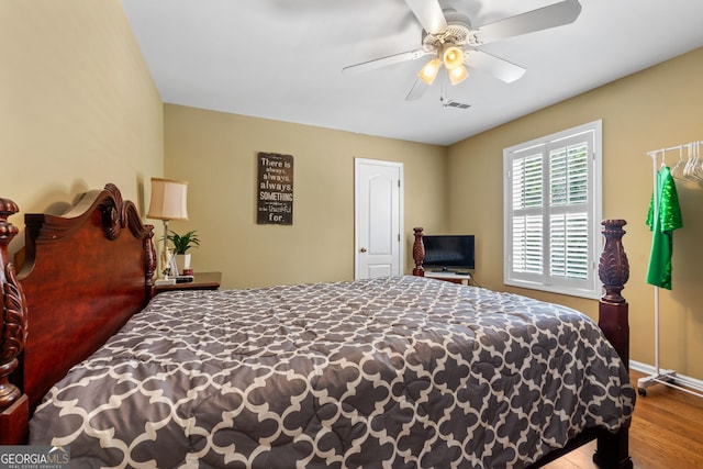 bedroom featuring ceiling fan and wood-type flooring