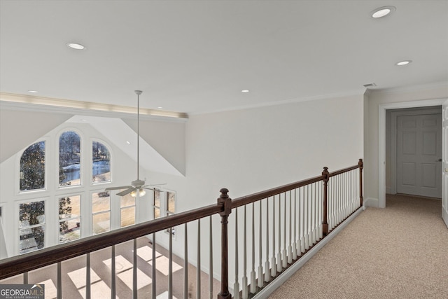 corridor with light colored carpet and ornamental molding