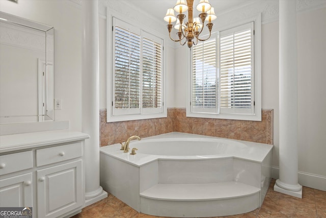 bathroom with a tub, a chandelier, a healthy amount of sunlight, and ornamental molding