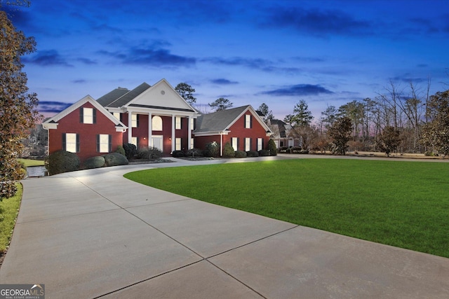 neoclassical / greek revival house with a lawn