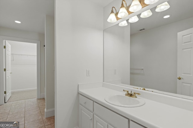 bathroom with tile patterned flooring and vanity