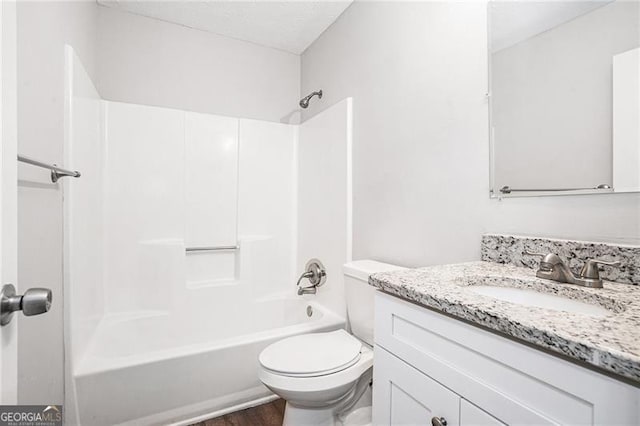 full bathroom with wood-type flooring, vanity, toilet, and shower / washtub combination