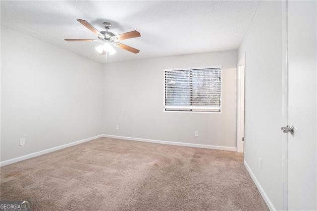 spare room with carpet flooring and ceiling fan