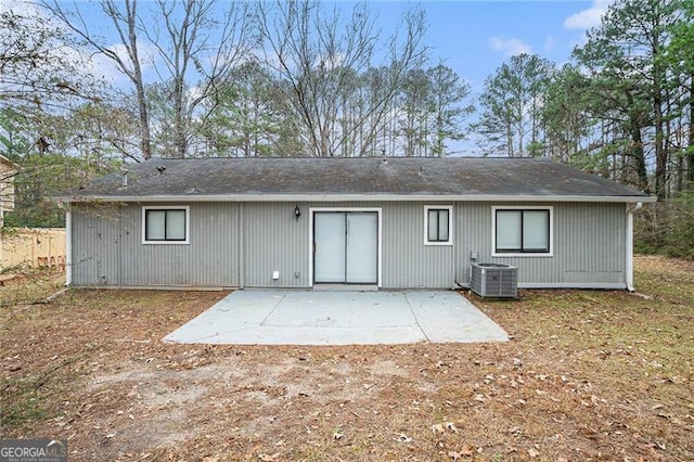 back of house with a patio area and central AC unit