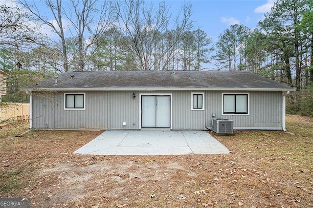 back of property featuring central air condition unit and a patio