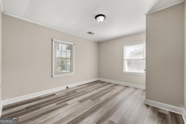 unfurnished room featuring light hardwood / wood-style flooring