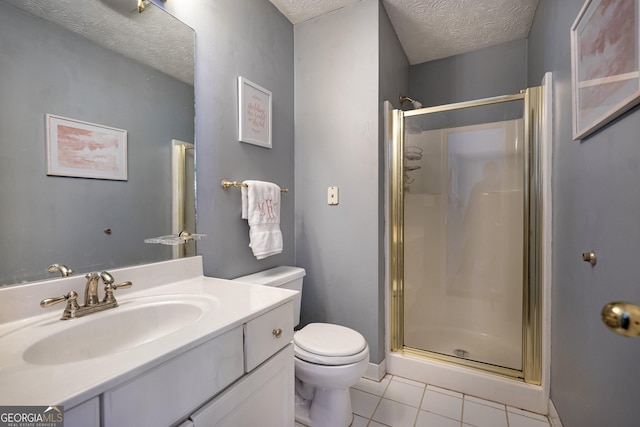 bathroom with walk in shower, tile patterned floors, a textured ceiling, toilet, and vanity