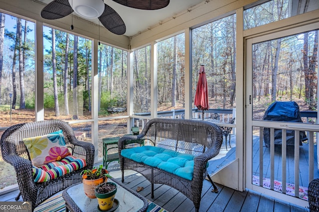 sunroom / solarium with ceiling fan