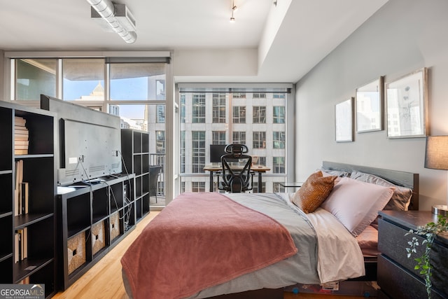 bedroom featuring hardwood / wood-style floors