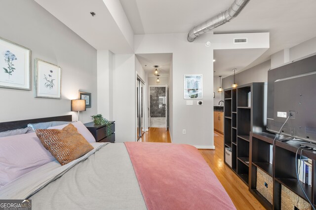 bedroom with light wood-type flooring