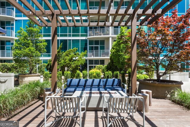 view of patio with a pergola and an outdoor hangout area