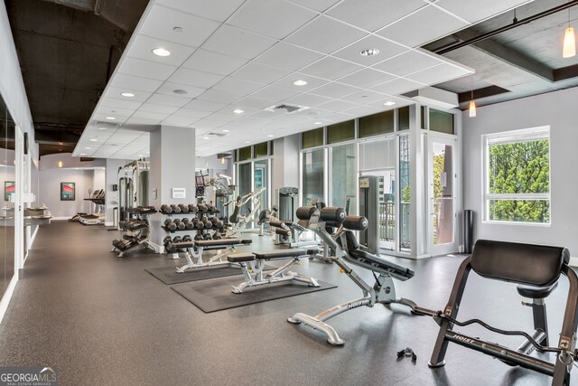 exercise room featuring a paneled ceiling