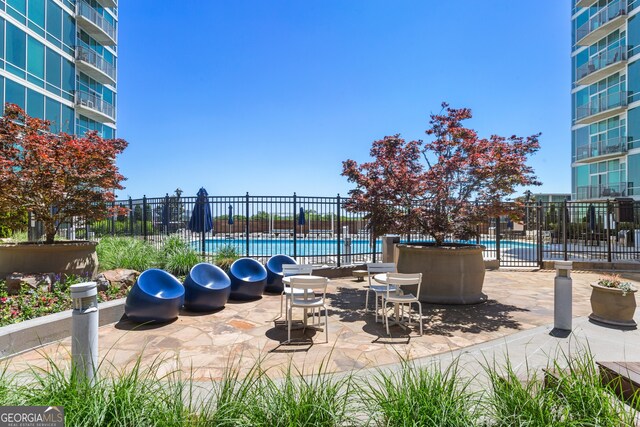 view of patio / terrace featuring a community pool