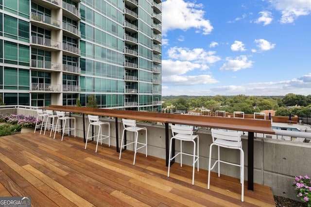 wooden deck with a bar