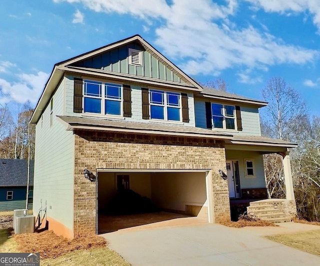 craftsman-style house with cooling unit and a garage