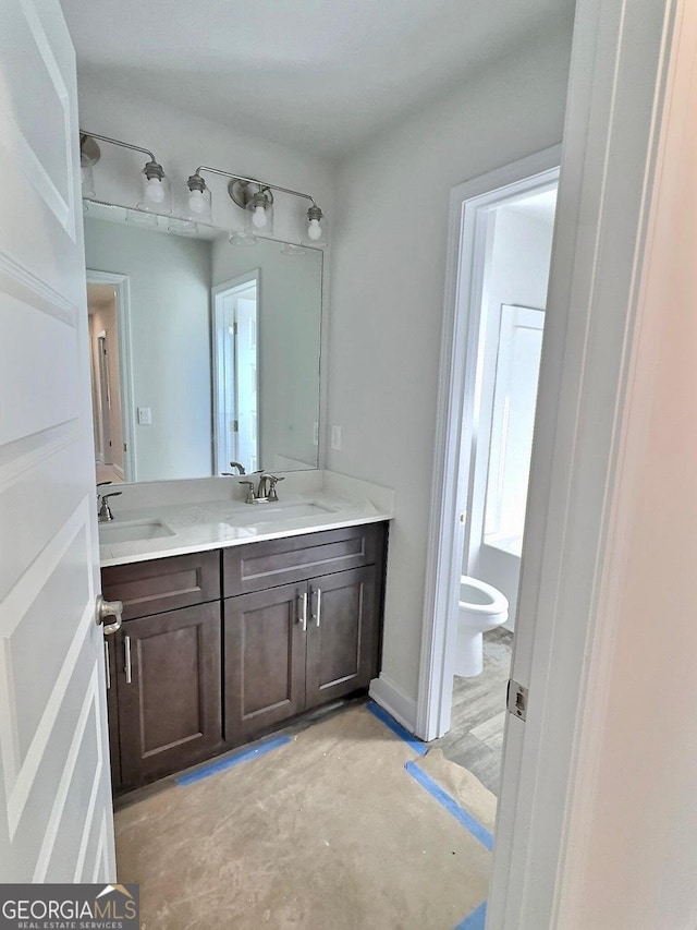 bathroom with vanity and toilet