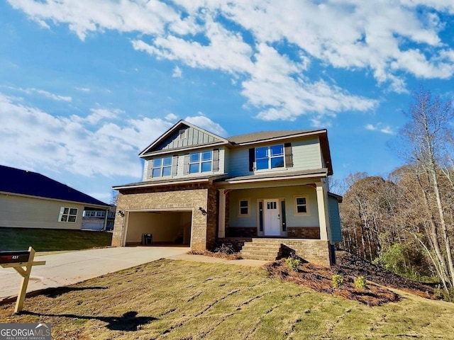 view of front of home featuring a porch and a garage