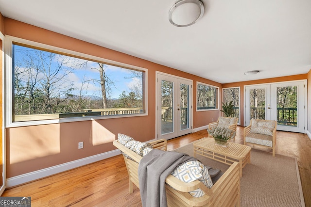 sunroom / solarium featuring french doors