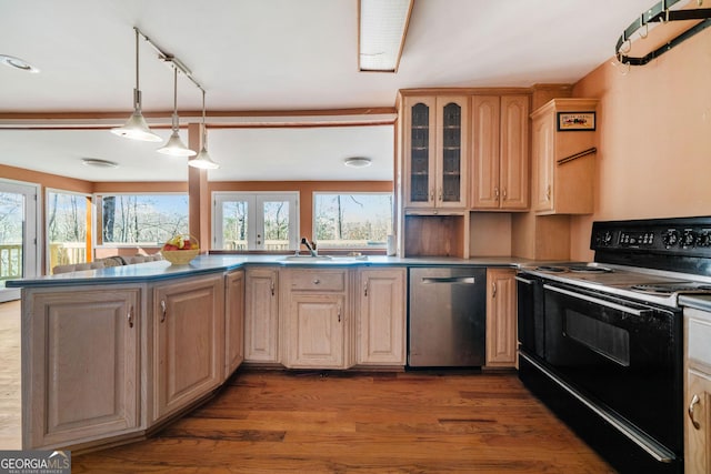 kitchen featuring pendant lighting, wood-type flooring, light brown cabinetry, black / electric stove, and stainless steel dishwasher