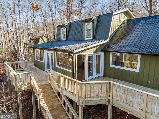 back of house with french doors and a deck