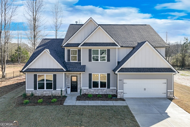240 Good Hope Preserve, Good Hope, GA 30641 - view of front of home with board and batten siding, an attached garage, driveway, a shingled roof, and stone siding