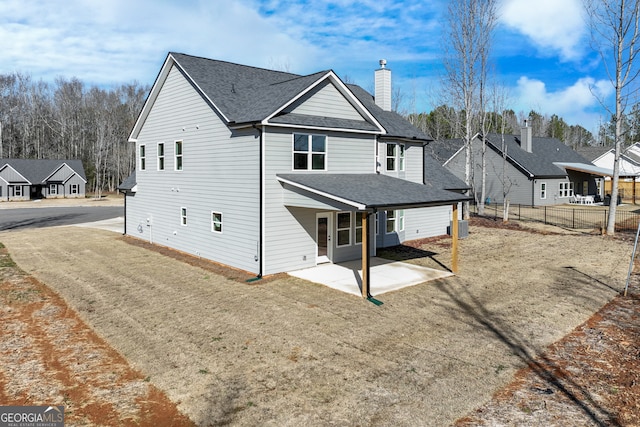 240 Good Hope Preserve, Good Hope, GA 30641 - rear view of property featuring a chimney, roof with shingles, and a patio