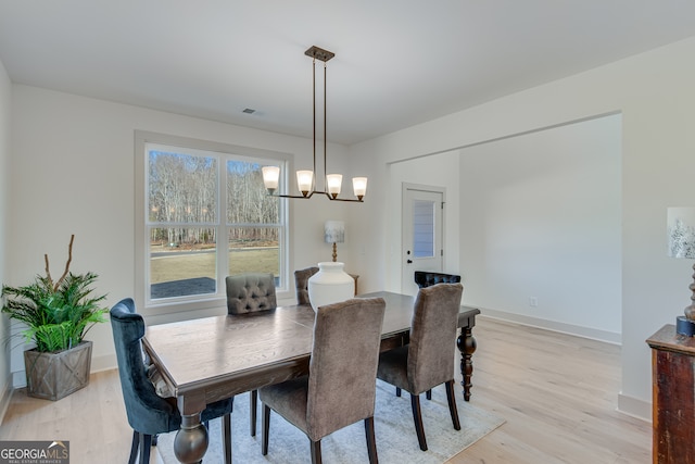 240 Good Hope Preserve, Good Hope, GA 30641 - dining room featuring light wood-style floors and a chandelier