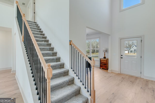 240 Good Hope Preserve, Good Hope, GA 30641 - foyer featuring light wood finished floors, a high ceiling, and stairway