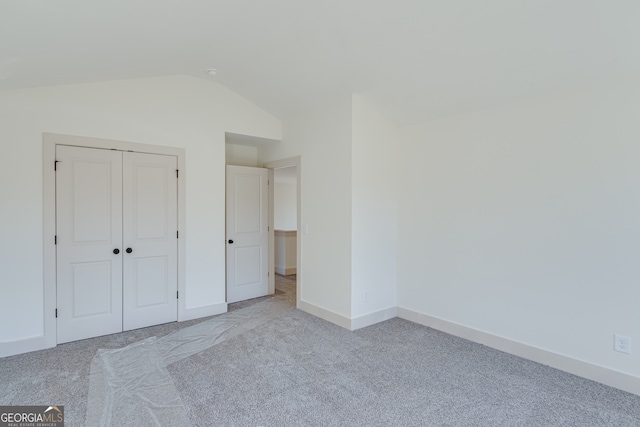 240 Good Hope Preserve, Good Hope, GA 30641 - unfurnished bedroom with carpet flooring, vaulted ceiling, and a closet
