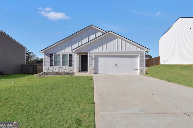 view of front of property with a front lawn and a garage