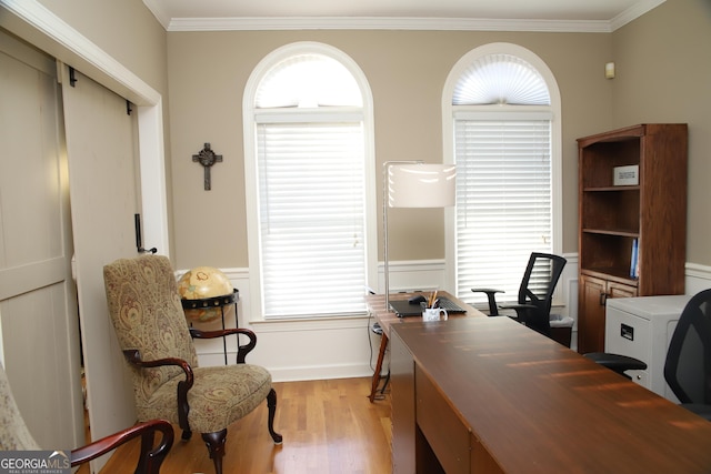 office space featuring crown molding and light hardwood / wood-style floors