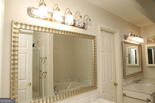 bathroom featuring separate shower and tub and vanity