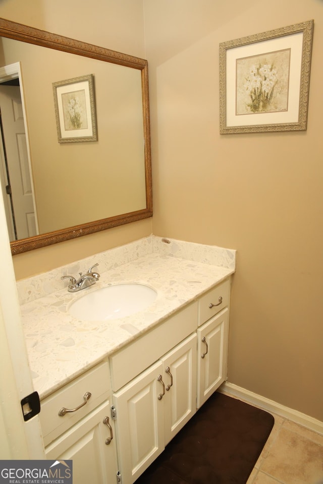 bathroom with tile patterned floors and vanity