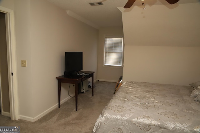 bedroom with carpet floors, ceiling fan, and lofted ceiling