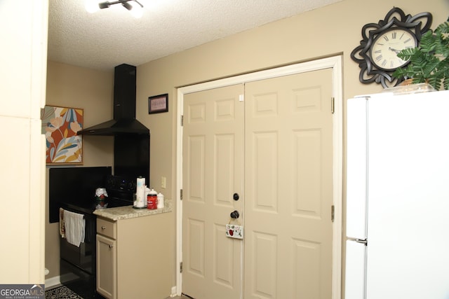 interior space with a textured ceiling, white fridge, black electric range oven, and exhaust hood