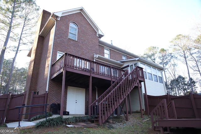 back of house with a wooden deck