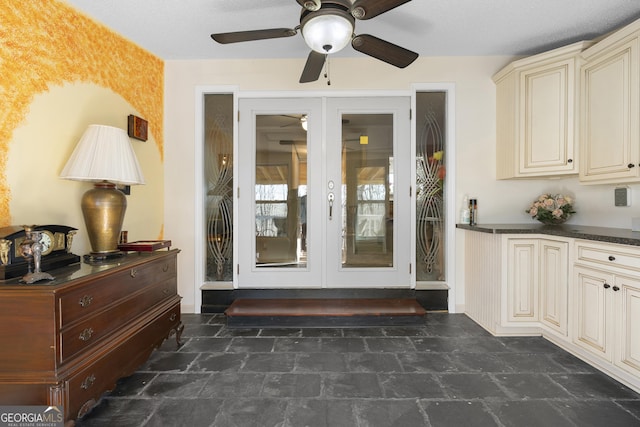 interior space with ceiling fan