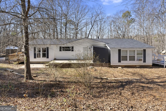 ranch-style home with a deck