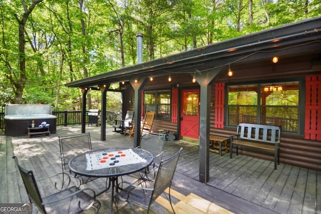 deck featuring a hot tub