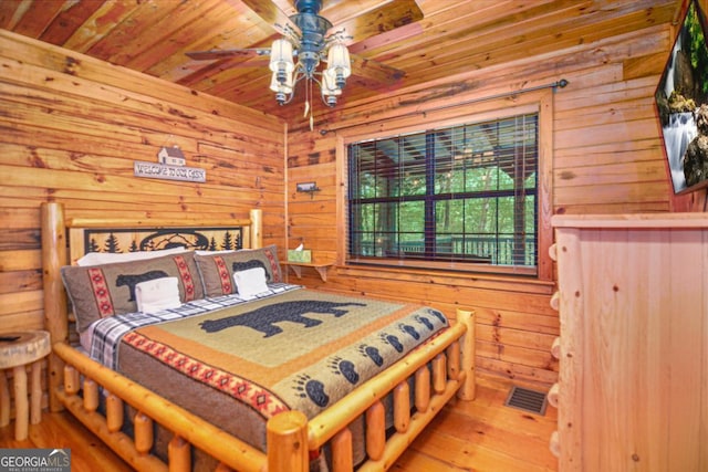 bedroom featuring ceiling fan, wooden ceiling, and wood-type flooring