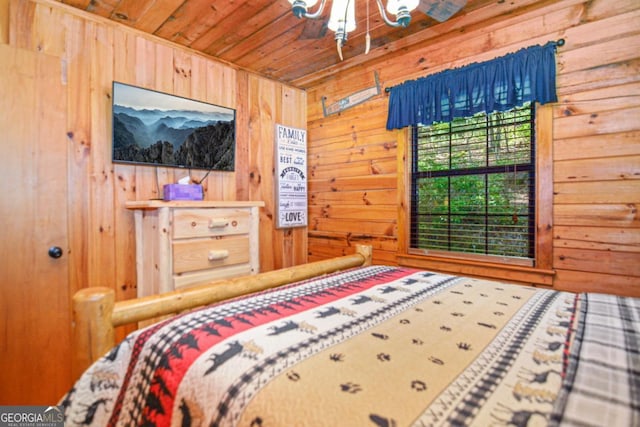 bedroom with wooden ceiling and wooden walls