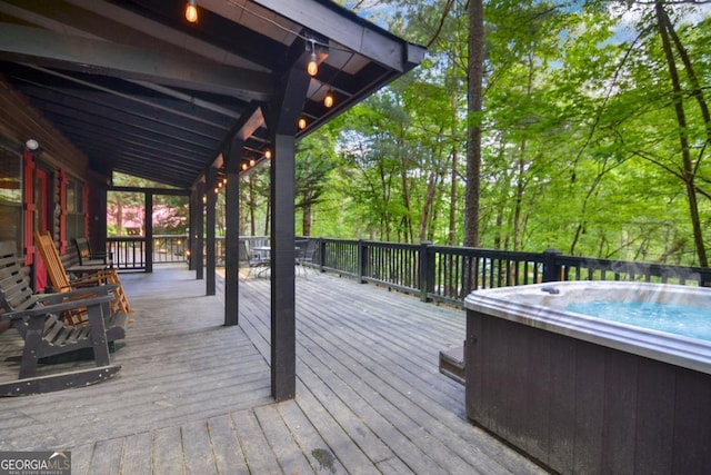 wooden terrace with a hot tub