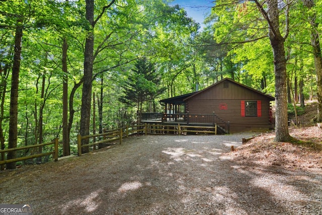 view of property exterior featuring a deck