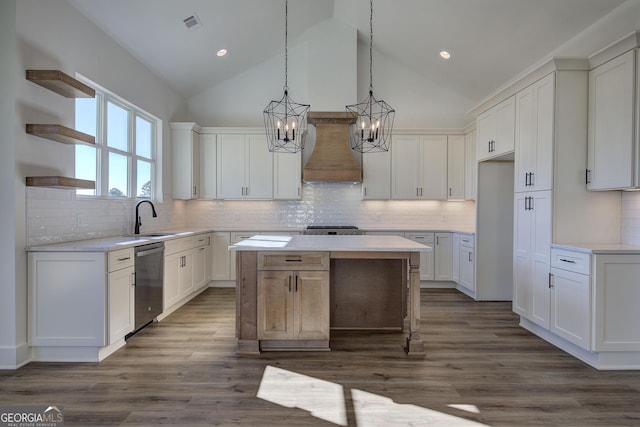 kitchen with premium range hood, sink, dishwasher, a center island, and white cabinetry