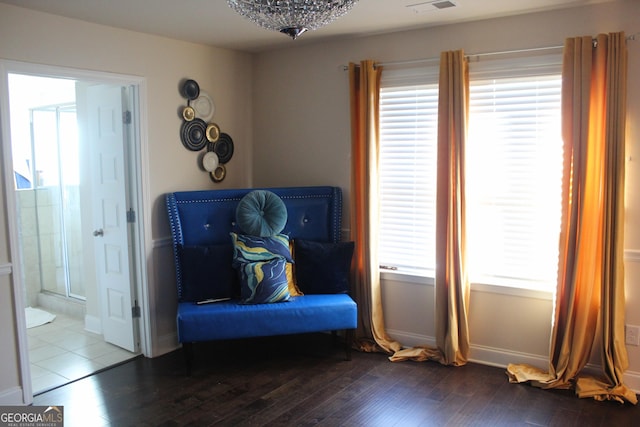 living area with hardwood / wood-style flooring and plenty of natural light